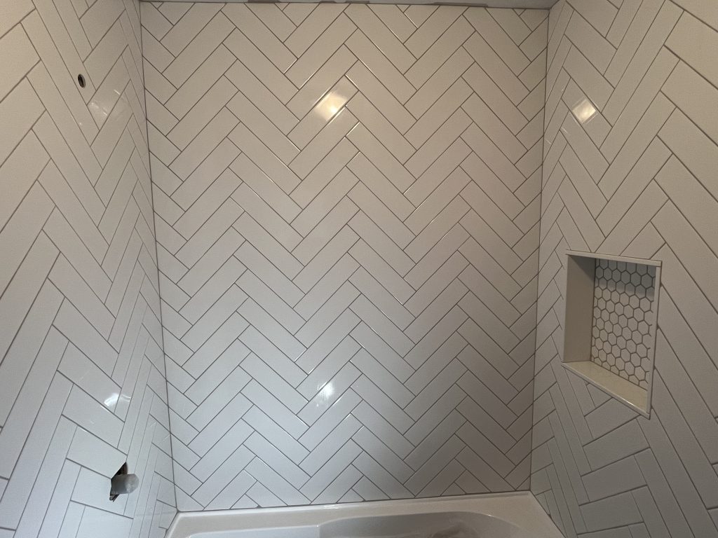 herringbone wall tile in the shower wall